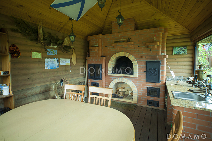 Проект каркасного дома с эркером и гаражом для одной машины