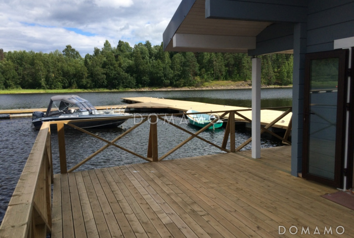 Проект деревянного дома из клееного бруса с крытой террасой расположенной по всему периметру дома