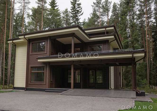 Проект двухэтажного дома из клееного бруса с парной и навесом для авто