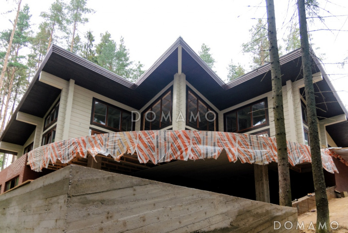 Проект дома из клееного бруса с просторной террасой площадью более 100 кв.м.