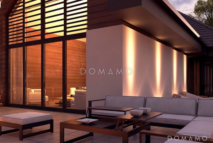 Проект большого одноэтажного дома из кирпича с четырьмя спальнями, гаражом и панорамным остеклением гостиной