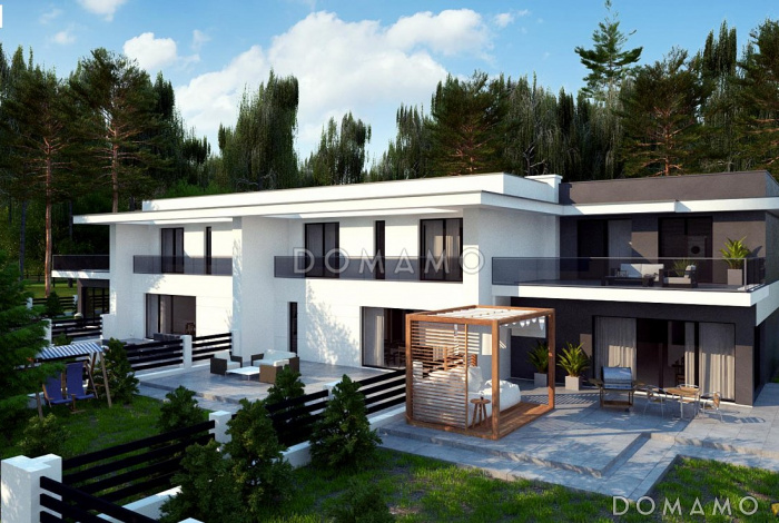 Проект современного комфортного двухэтажного дома из газобетона для двух семей с общим гаражом