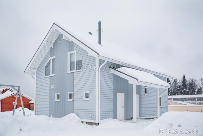 Проект кирпичного коттеджа в скандинавском стиле с 4 спальнями, светлой гостиной и террасой