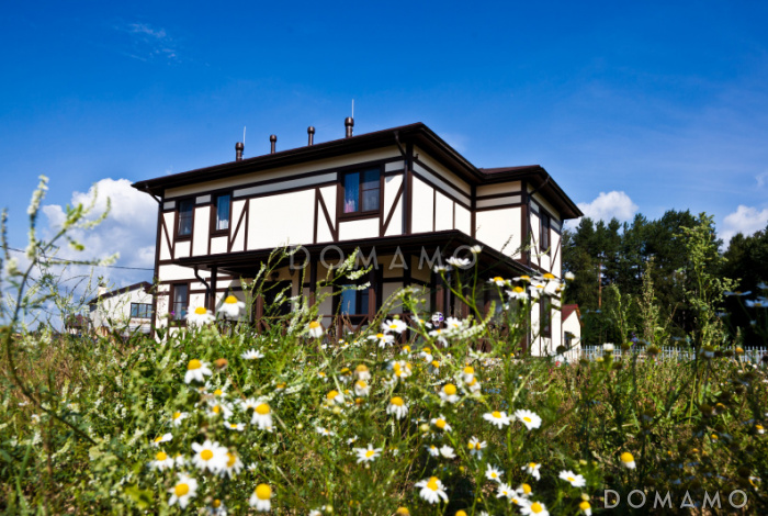 Проект двухэтажного дома из кирпича в стиле фахверк