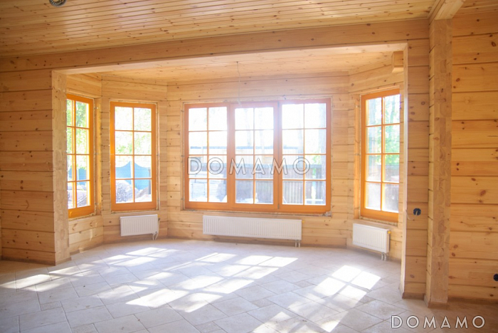 Проект дома из клееного бруса с гостиной, совмещенной с кухней-столовой