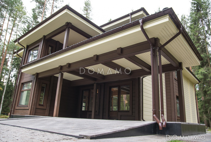 Проект двухэтажного дома из клееного бруса с парной и навесом для авто