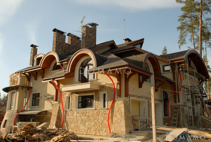 Проект коттеджа в стиле модерн с гаражом, зимним садом и сауной