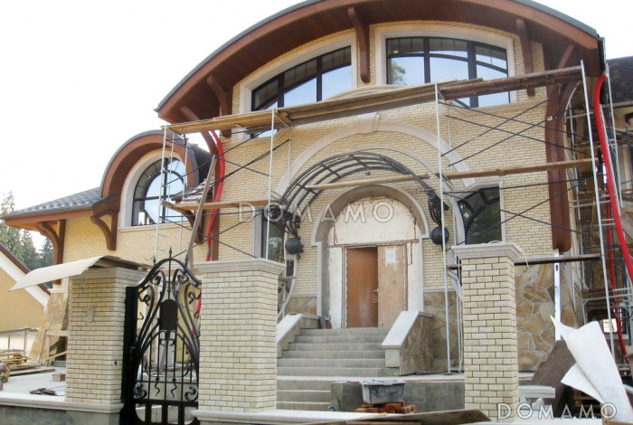 Проект коттеджа в стиле модерн с гаражом, зимним садом и сауной