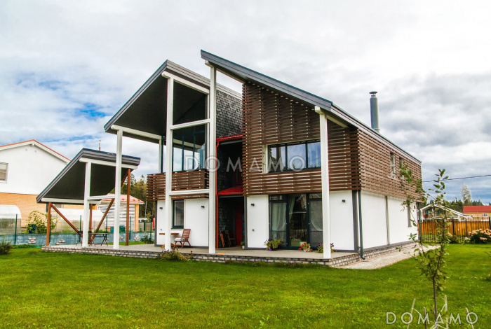 Проект современного дома из пеноблоков с изолированной кухней